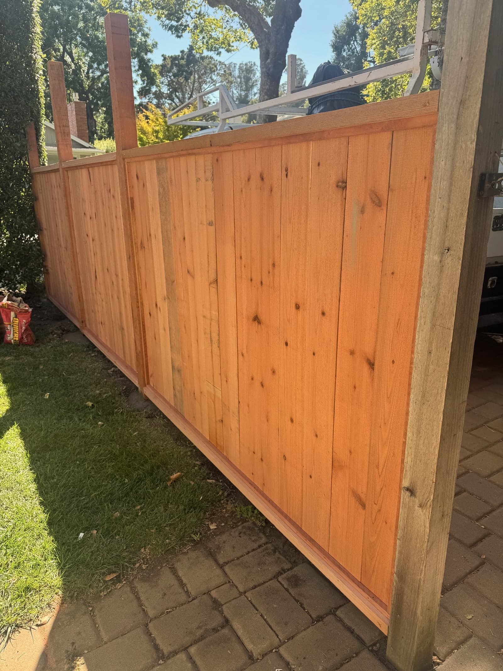 Redwood fence panel detail with framed boards.