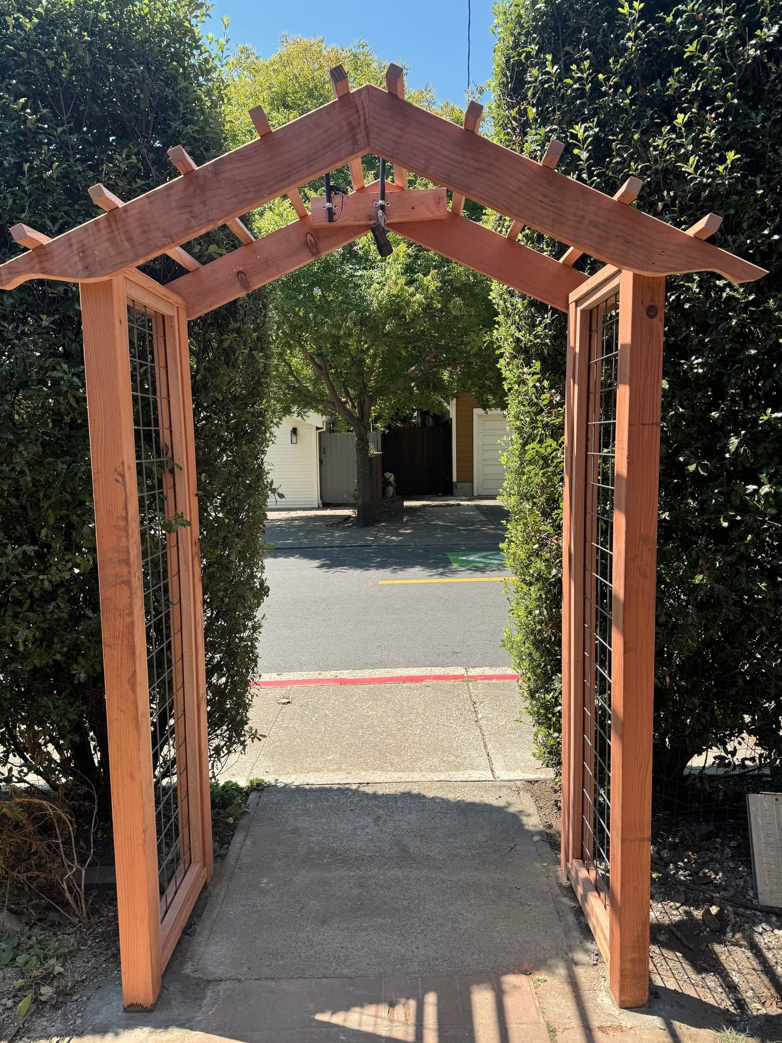Wood arbor and gate frame project at a residential entry.